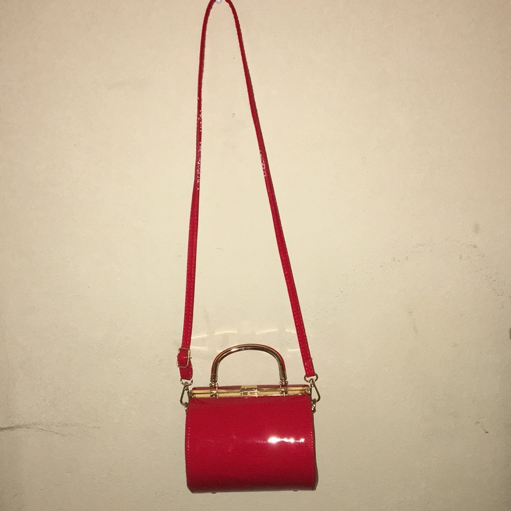 Red cylinder crossbody bag